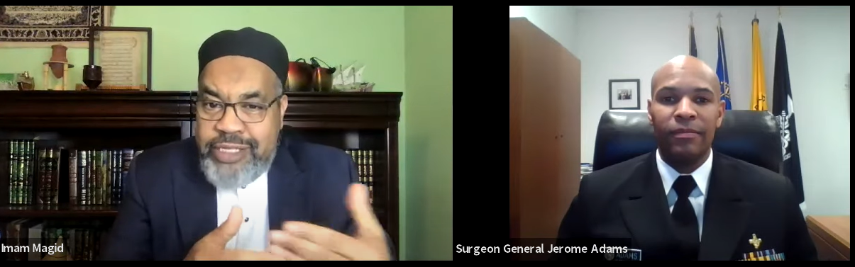 A black man and a Muslim Imam speaking