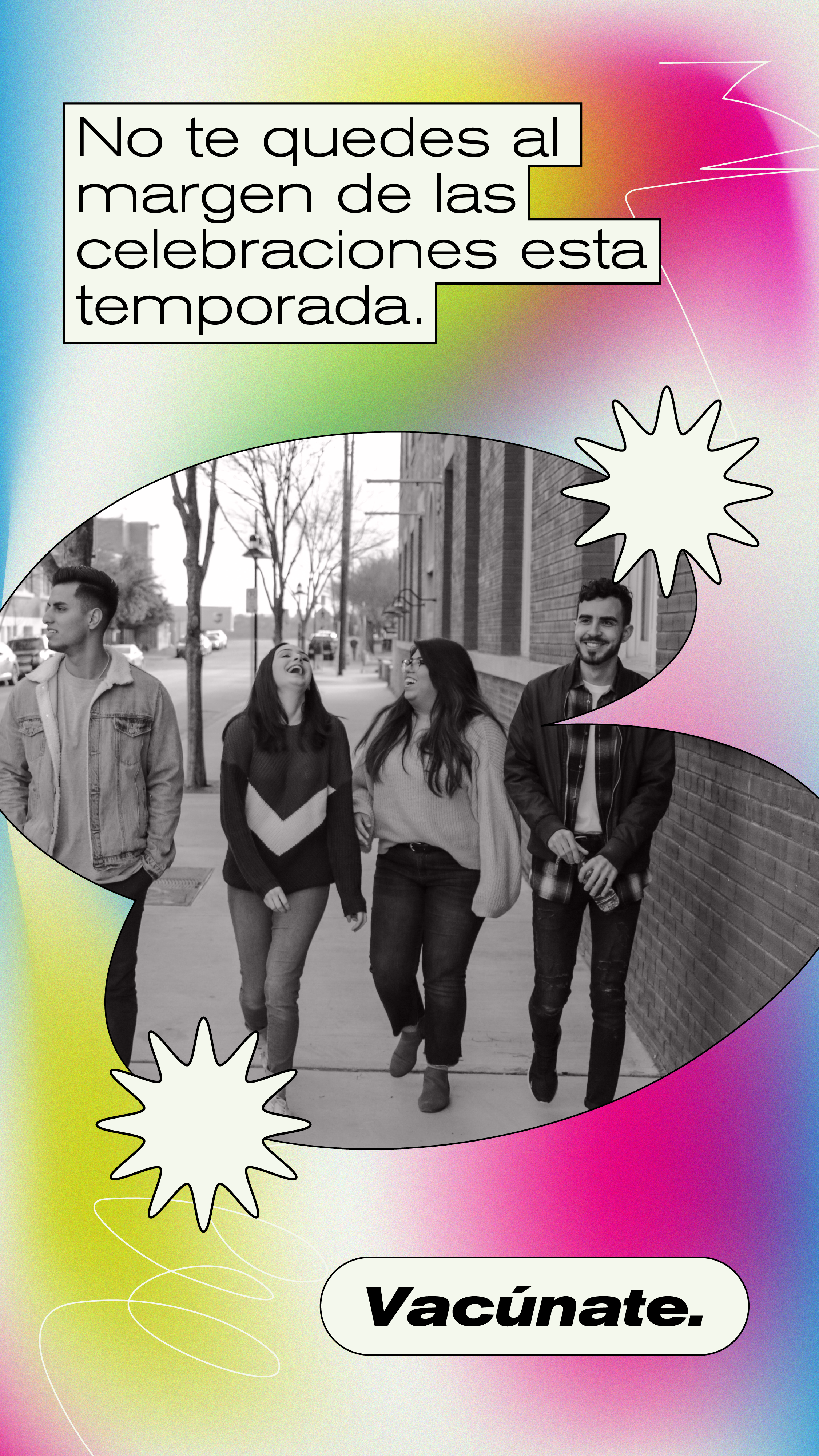 Young people laugh walking along a street together