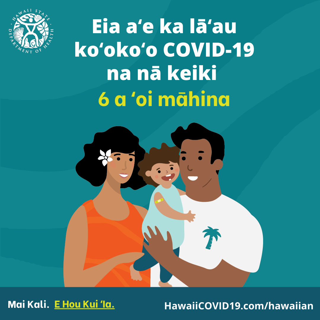 A man and woman smile holding a smiling baby