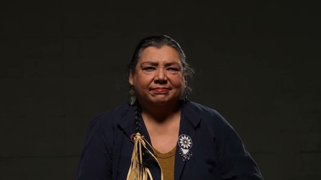 Anita Gates sits and speaks to the camera 