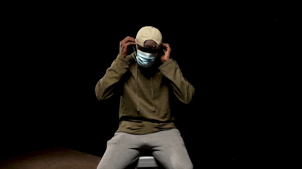 Faiz Abdirahman sits and speaks to the camera