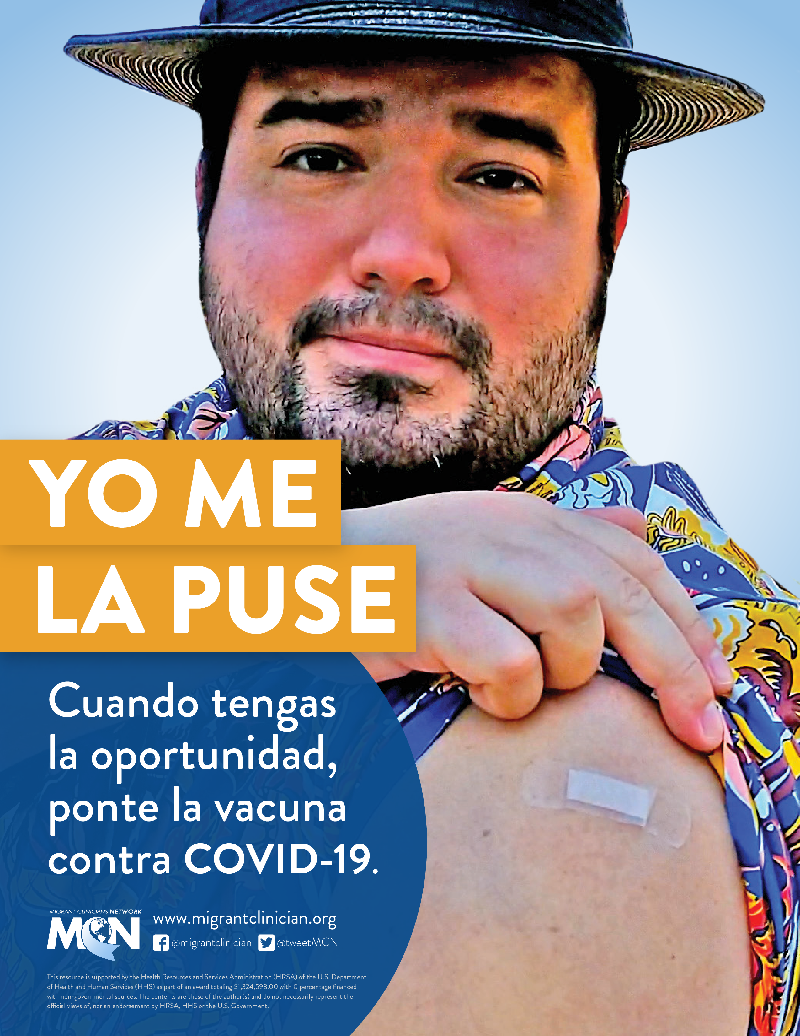 Man wearing a hat proudly shows off his vaccination.