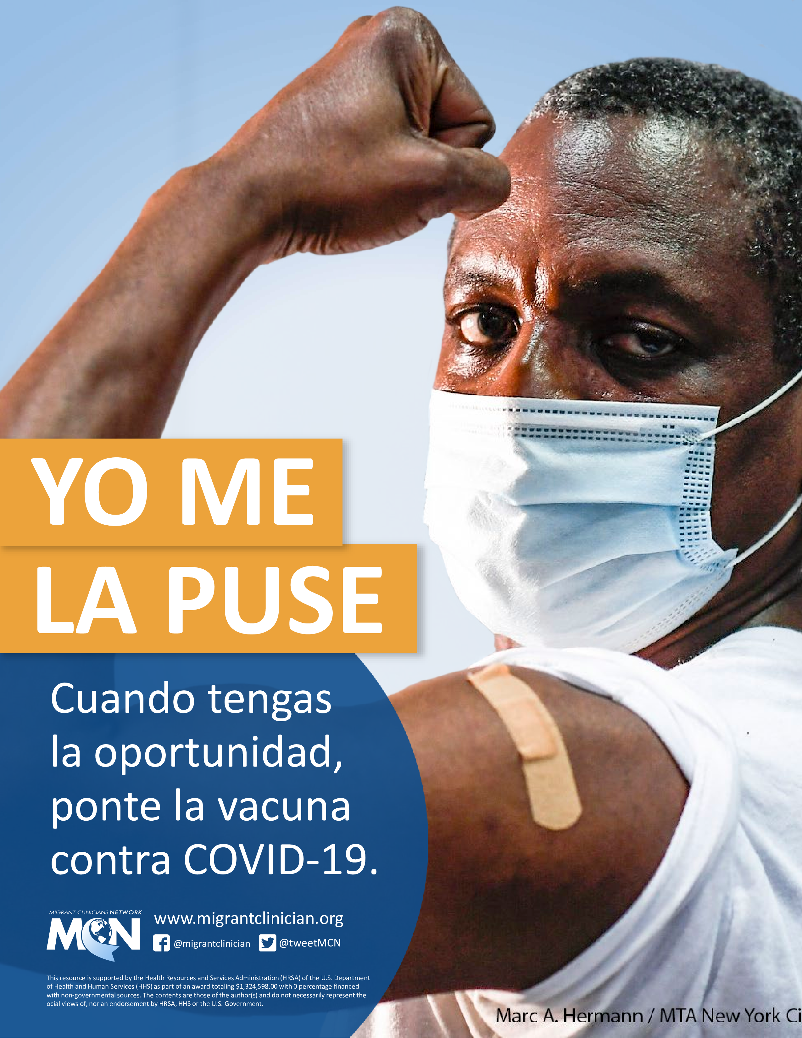 Older Black man flexes his arm and proudly shows off his vaccination.