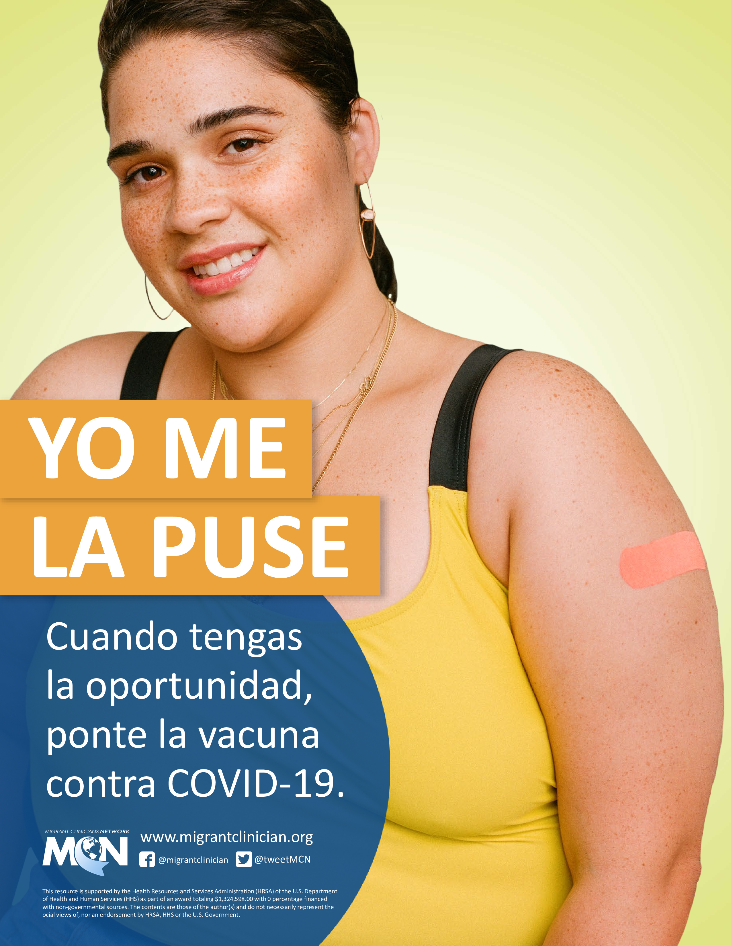 Young woman of color smiles and shows off her vaccination.