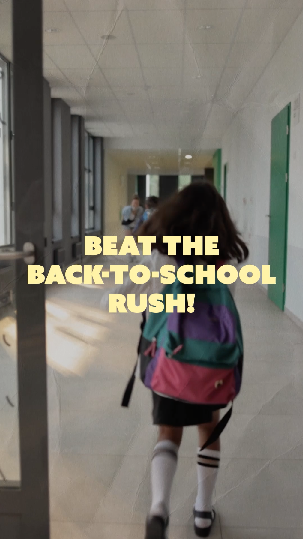Video opens on a girl wearing a backpack skipping through the school halls with yellow text that reads: “Beat the back-to-school rush!” The next frame is a blue background with yellow text that reads: “Schedule your child’s vaccines today!”