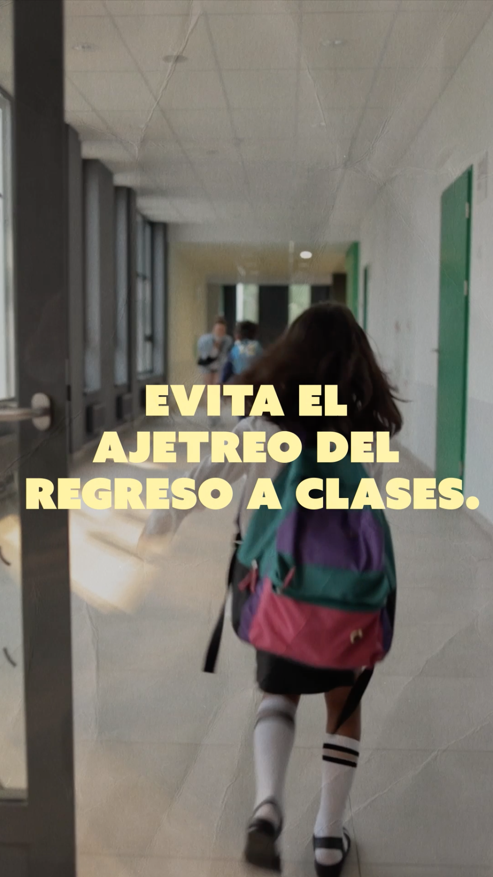 Video opens on a girl wearing a backpack skipping through the school halls with yellow text that reads: “Beat the back-to-school rush!” The next frame is a blue background with yellow text that reads: “Schedule your child’s vaccines today!”