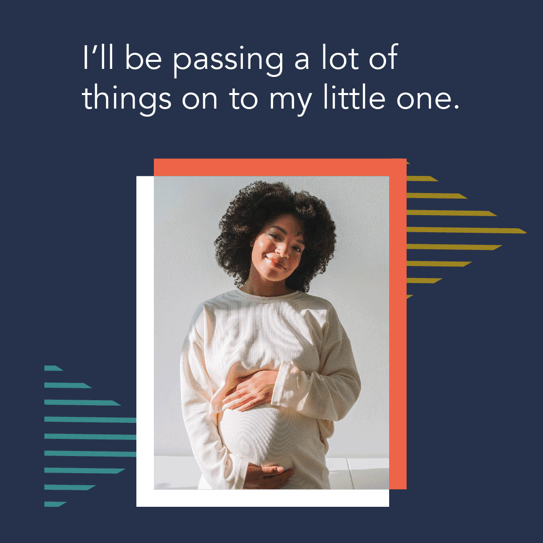 A Black pregnant woman smiles and places her hands over her stomach 