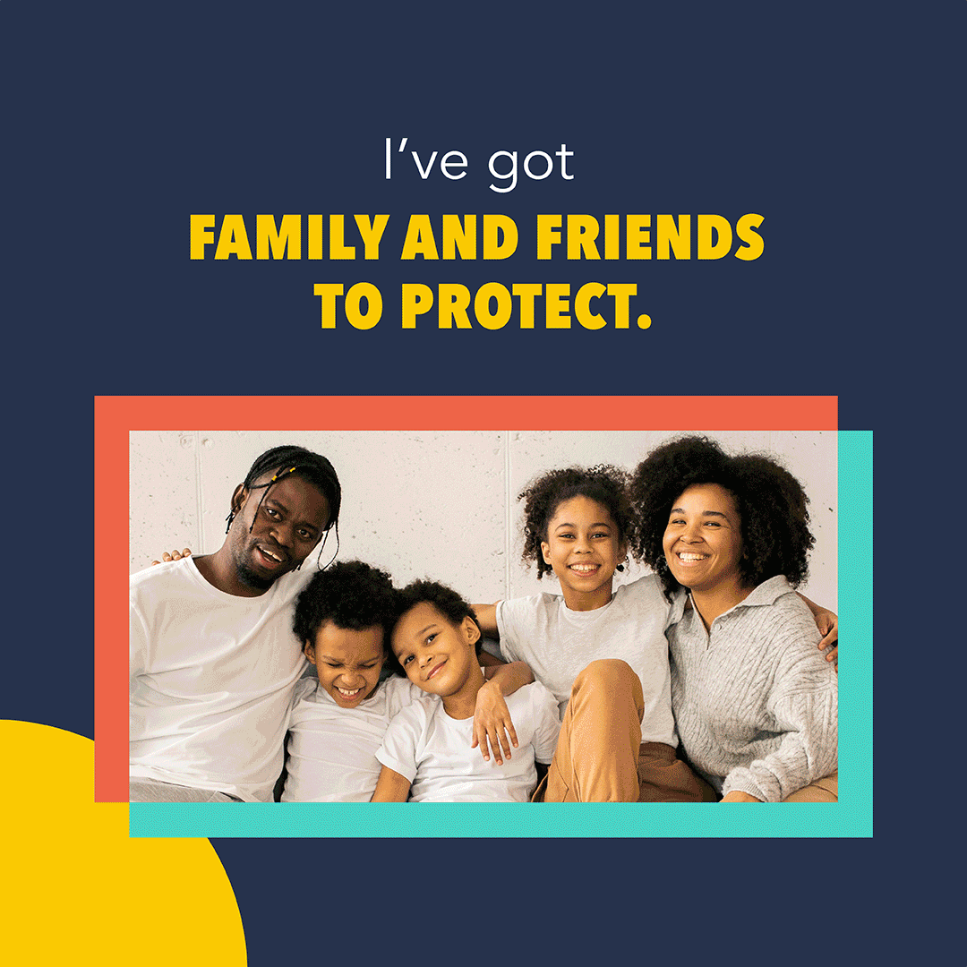 Image of a family of five, all of whom are black and wearing white shirts while smiling at the camera.
