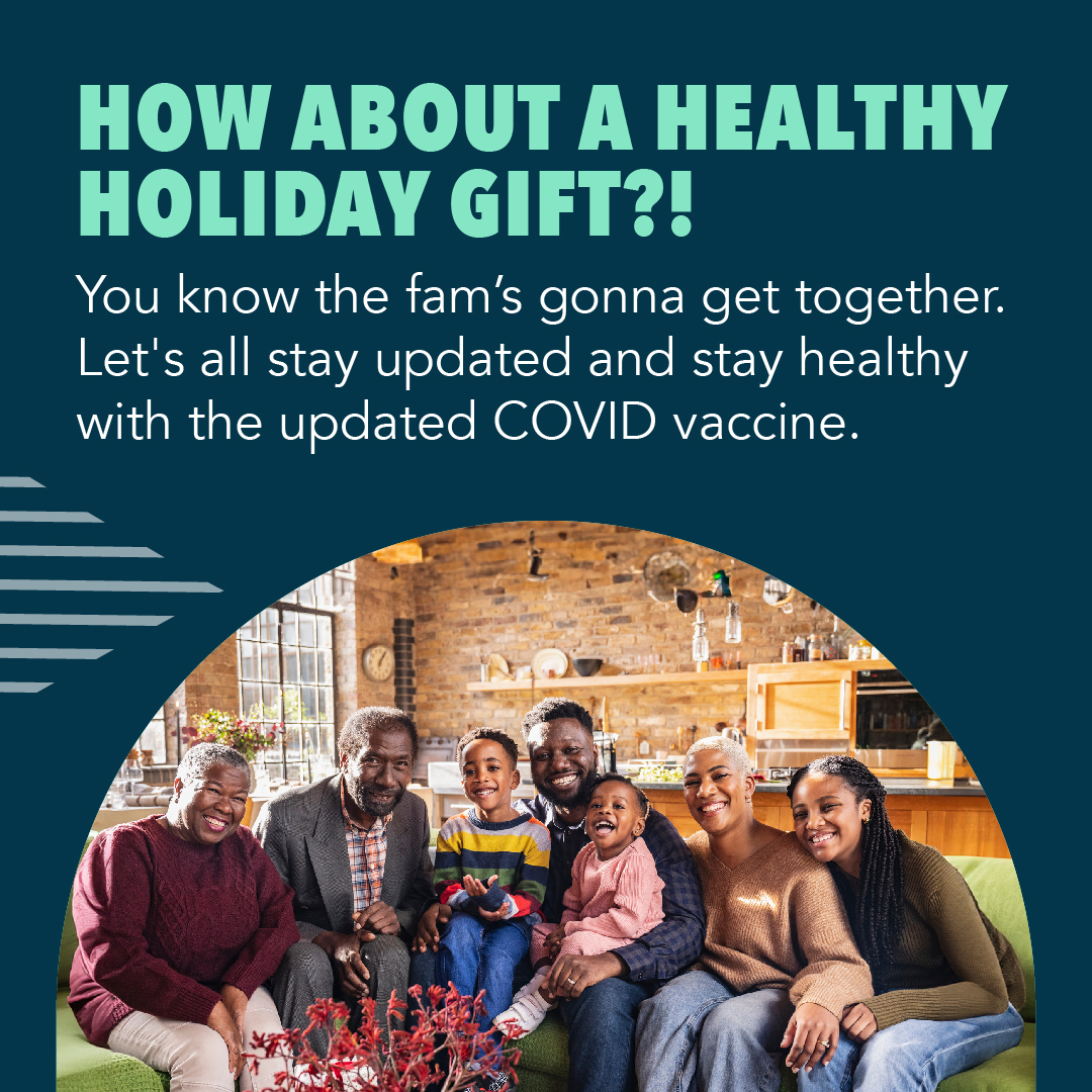 A Black family sits and poses for a picture together 