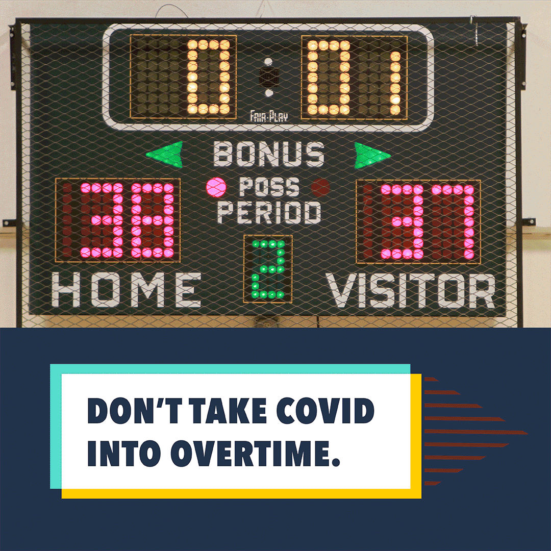 Image shows a scoreboard at a basketball game