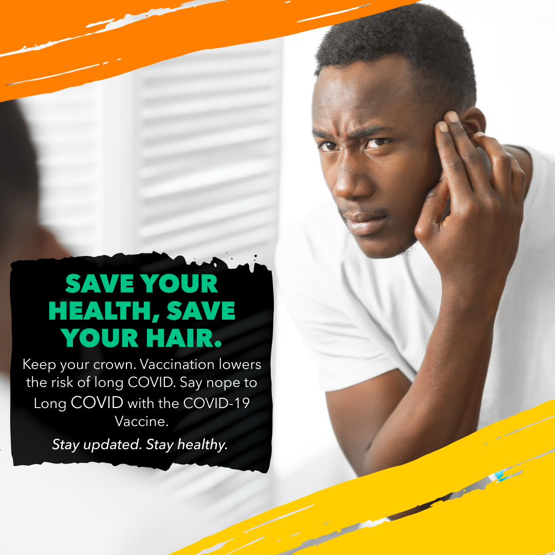 Black man looks in the mirror, touching his hairline and looking concerned.