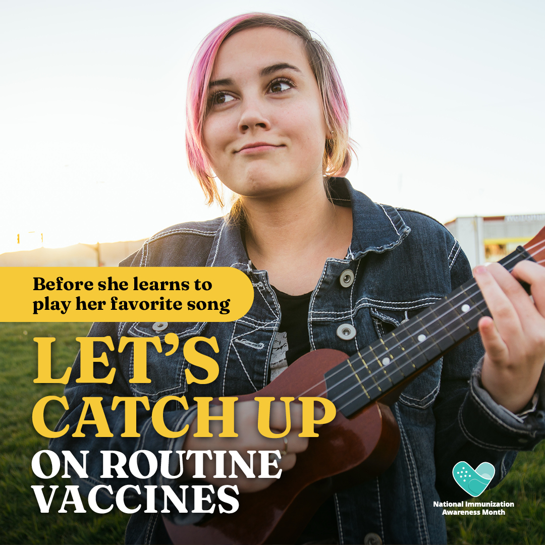Image of teenager with pink hair playing a ukulele. 
