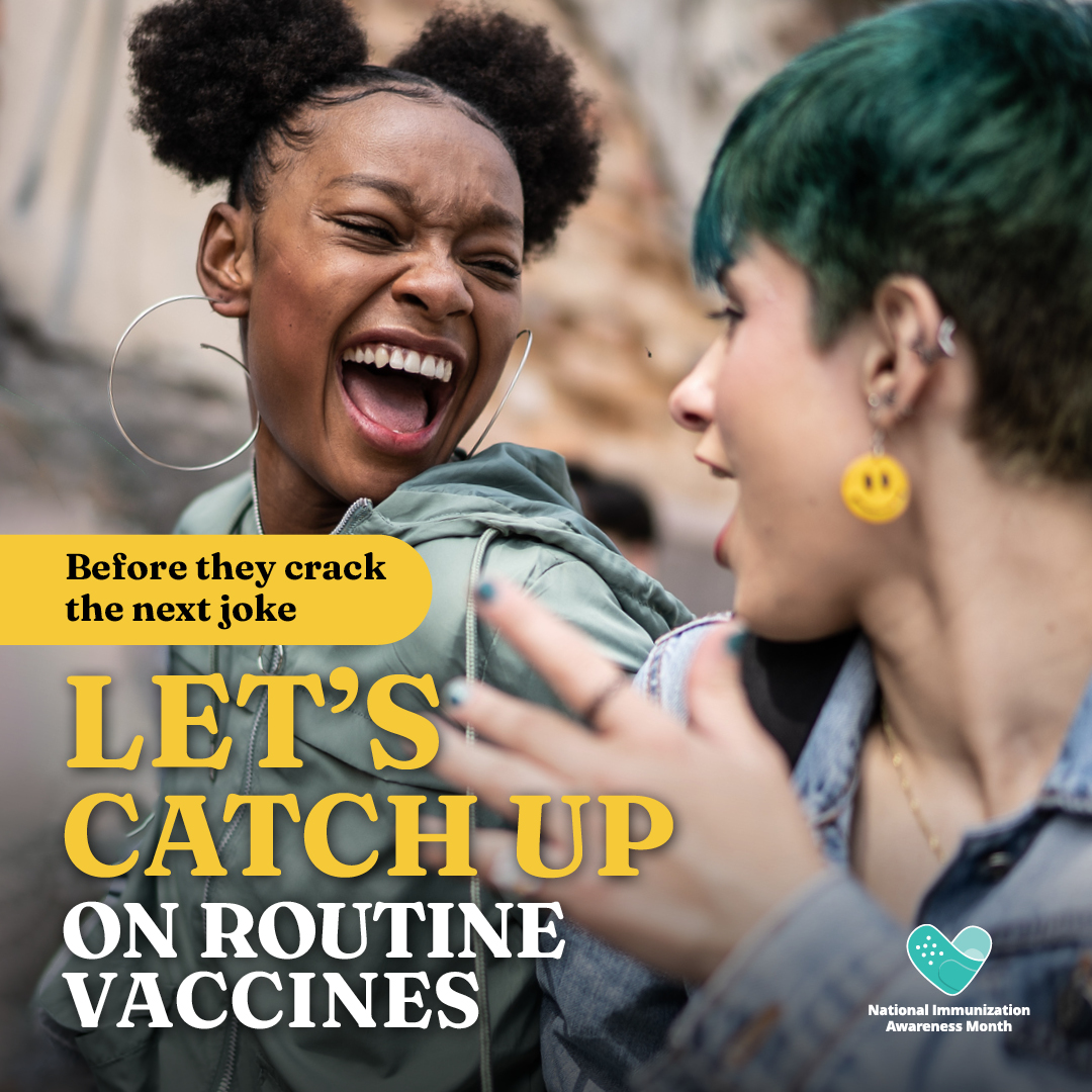 Image of a laughing black teenage girl and talking to a smiling white teenager.