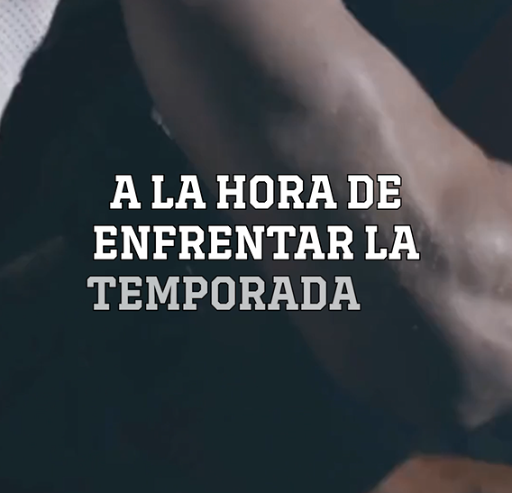 Two football players in full gear tackling each other.