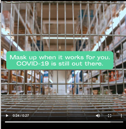 Screenshot of cart in grocery aisle. Text reads ' Mask up when it works for you, COVID-19 is still out there.' Example reasons to mask up in video include being immunocompromised and not wanting to catch COVID on vacation.
