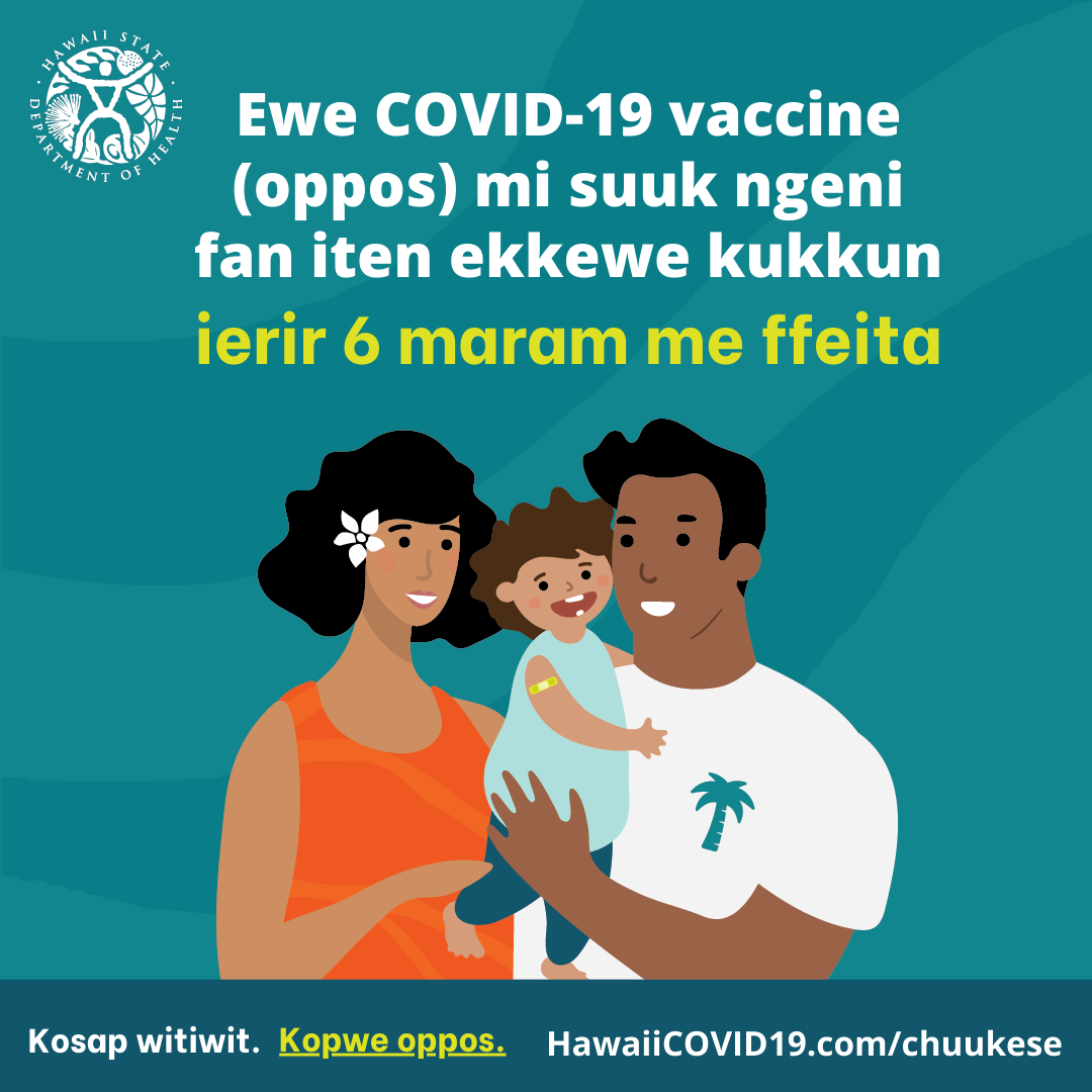 A man and woman smile holding a smiling baby