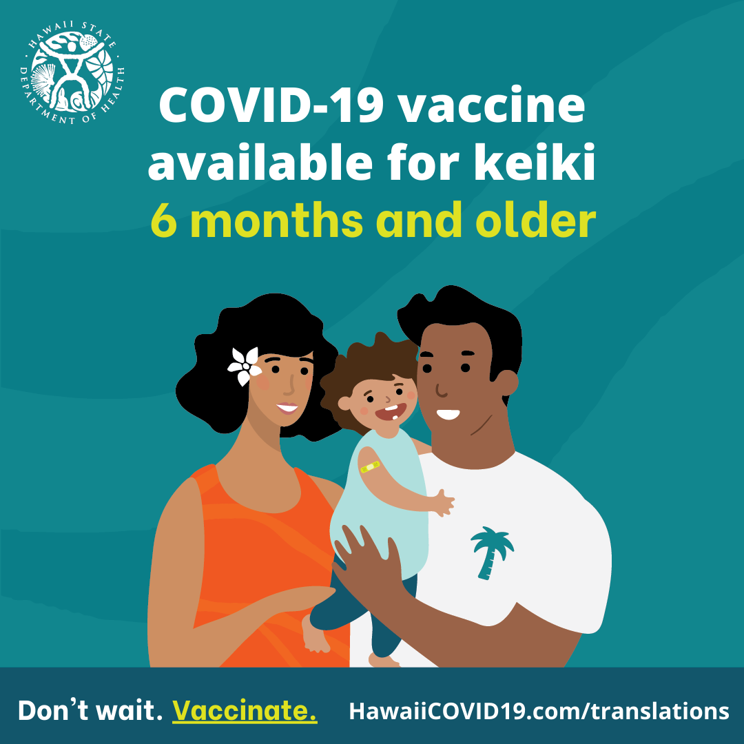 A man and woman smile holding a smiling baby