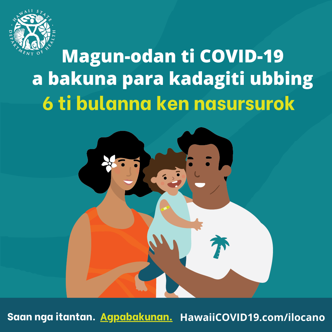 A man and woman smile holding a smiling baby