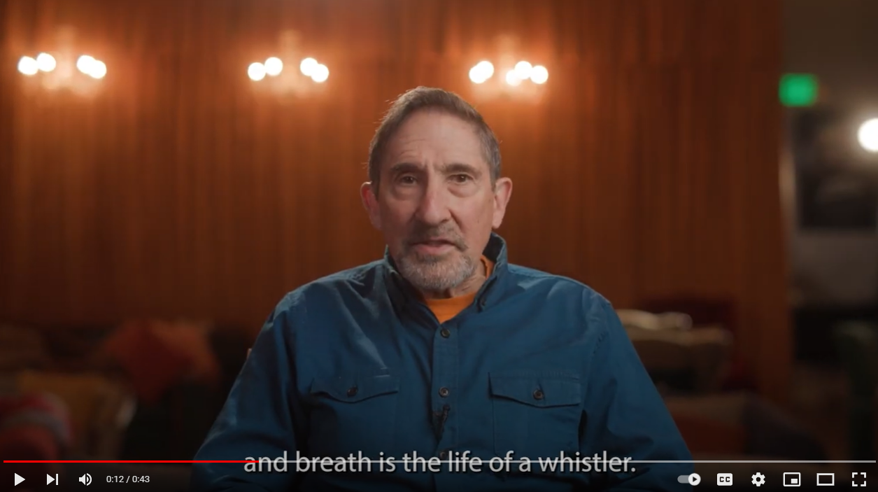 A man sits and talks 