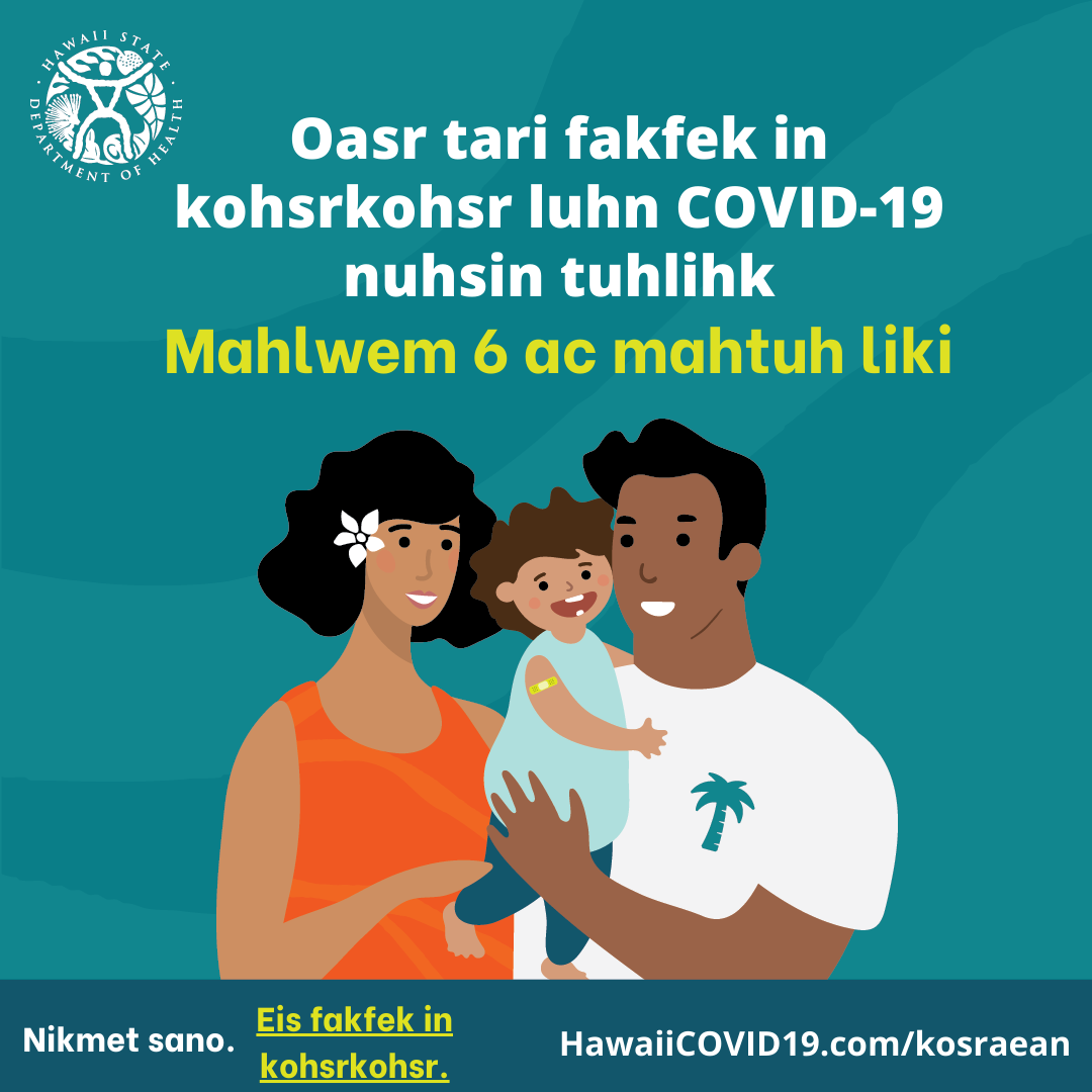 A man and woman smile holding a smiling baby