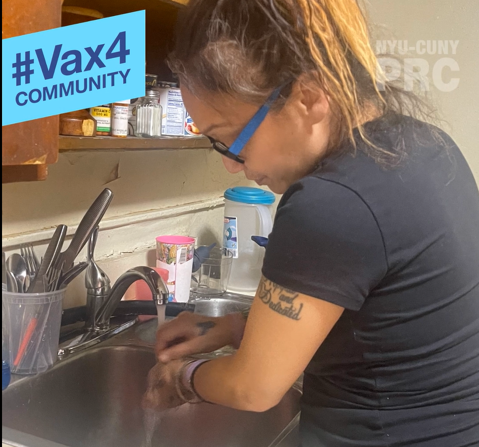 Woman washes dishes in her home