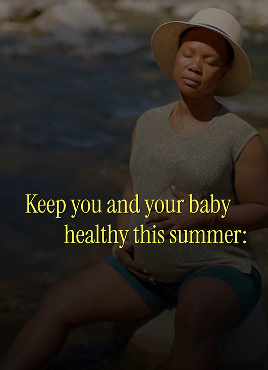 Pregnant black woman sitting outside