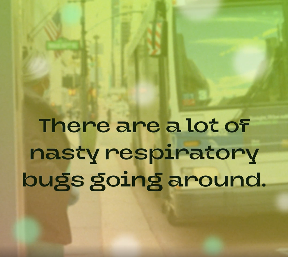 A Black woman wearing a mask boards a bus