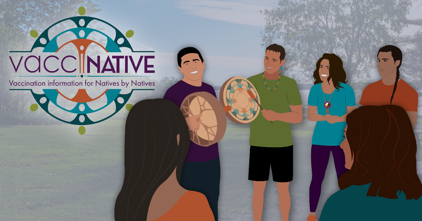 A group of smiling Native people stand in a circle outside, while two of them play the drums.