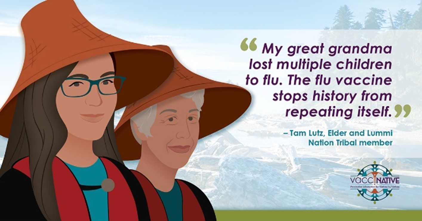A young Native woman stands smiling and wearing a hat besides a Native elder also smiling and wearing the same hat.