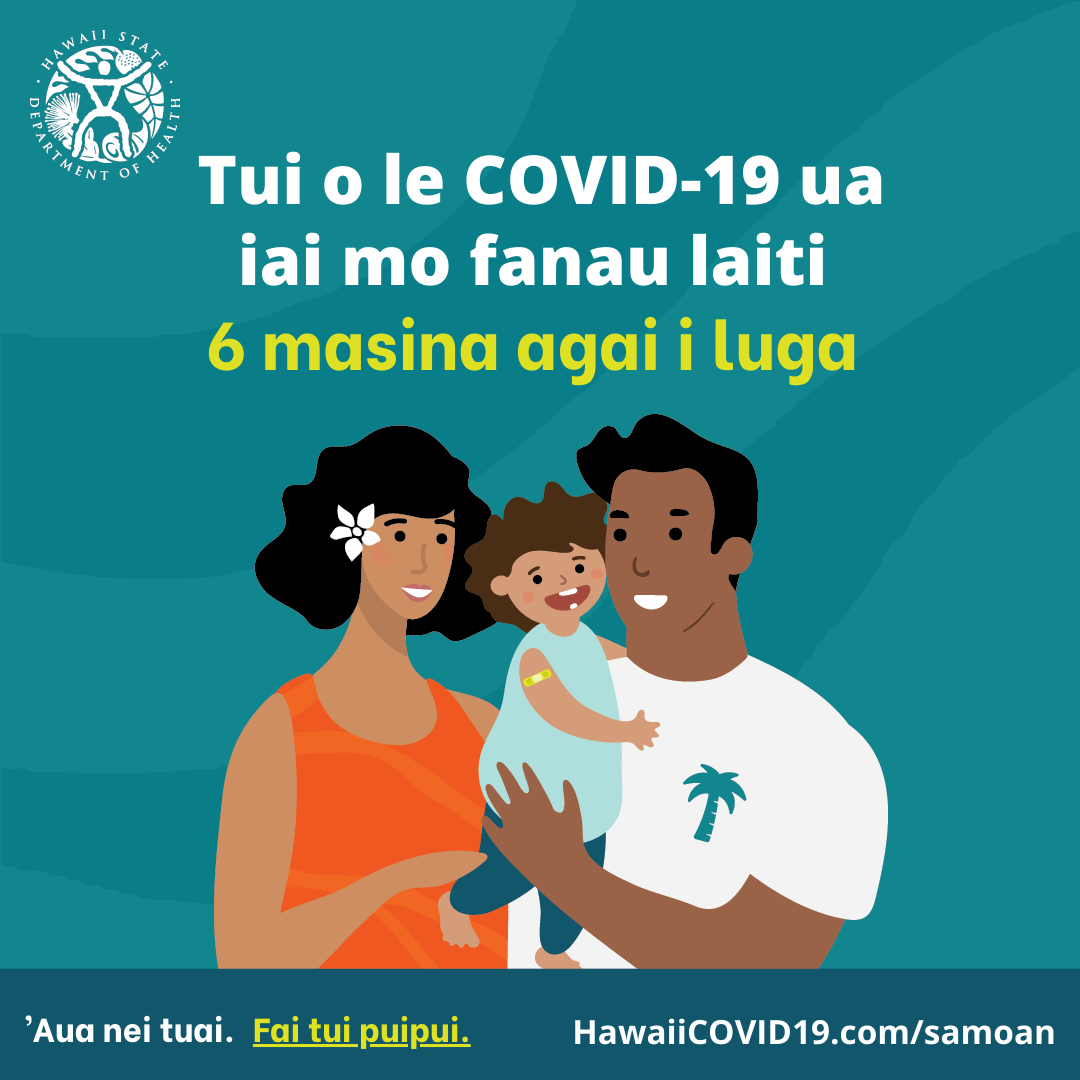 A man and woman smile holding a smiling baby