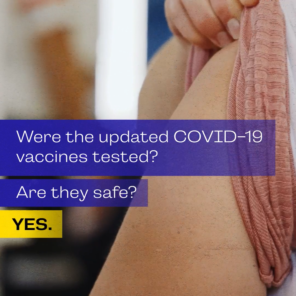 Video still shows a person's arm with a rolled-up sleeve, preparing to be vaccinated.