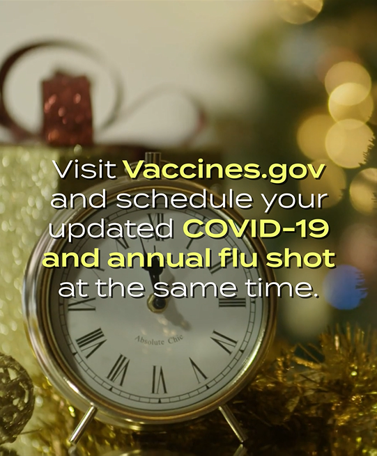 Video still shows text in front of gold clock surrounded with gold holiday decorations.