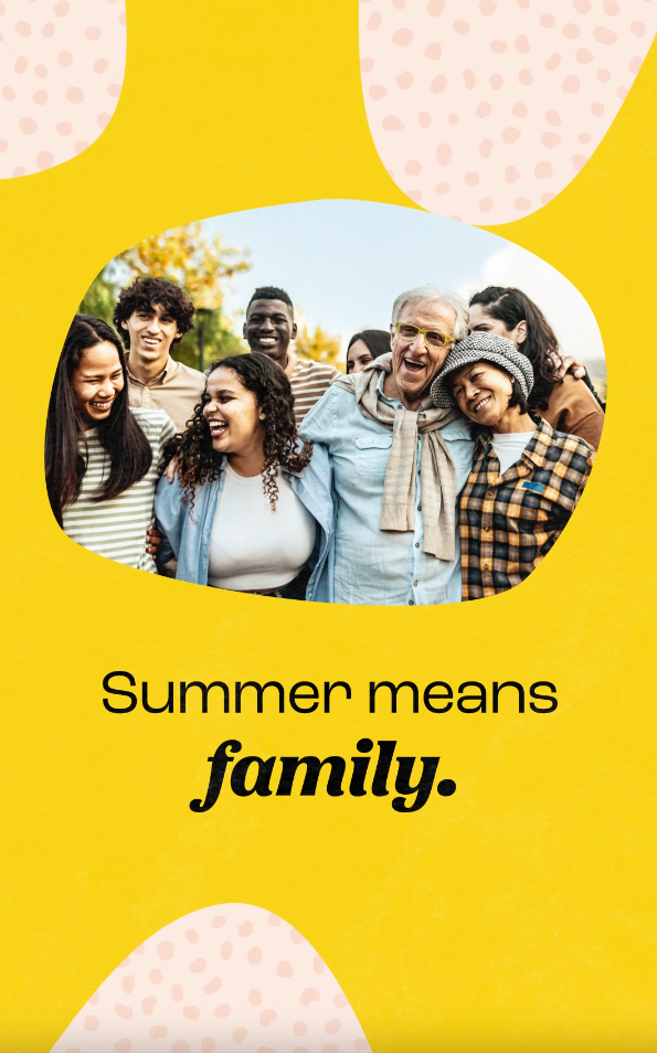 Video still shows a group of eight people of various ages and races standing arm-in-arm and laughing together.