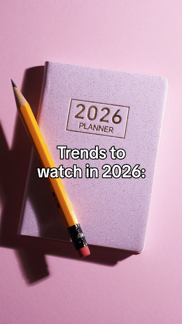 Video opens on a close-up of a 2026 planner. Text reads: “Trends to watch in 2026.” Then clips appear of ’80s-inspired fashion and arcades with text: “The ’80s are back.” Then clips appear of people creating content with text: “Raw, real storytelling is in.” Then it switches to clips of a Band-Aid on an arm and vaccine vials and reads: “Staying up to date on vaccines = timeless protection.” Lastly, warm scenes of families and friends reads: “Caring for each other never goes out of style.”
