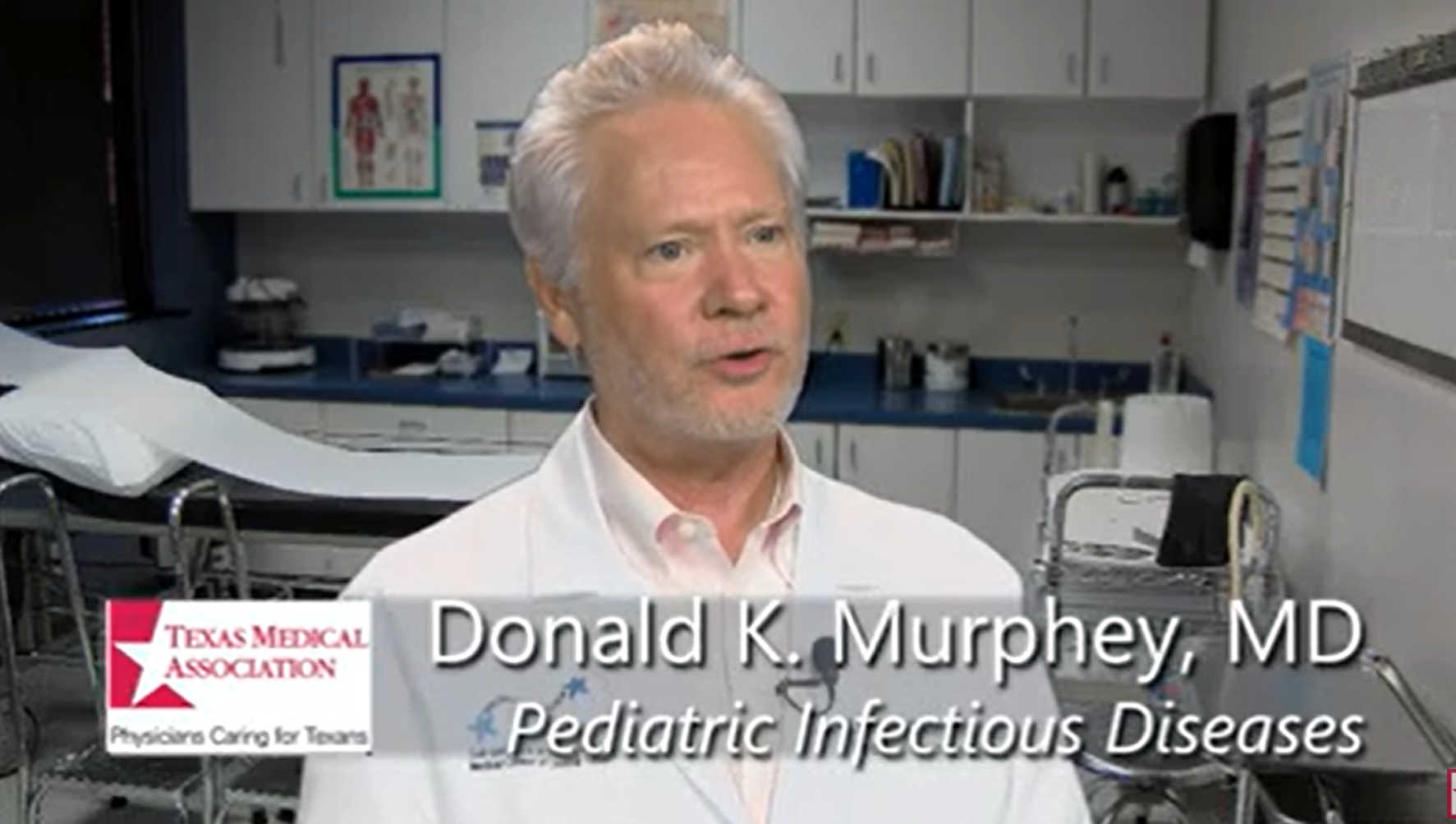 Doctor stands in an examination room