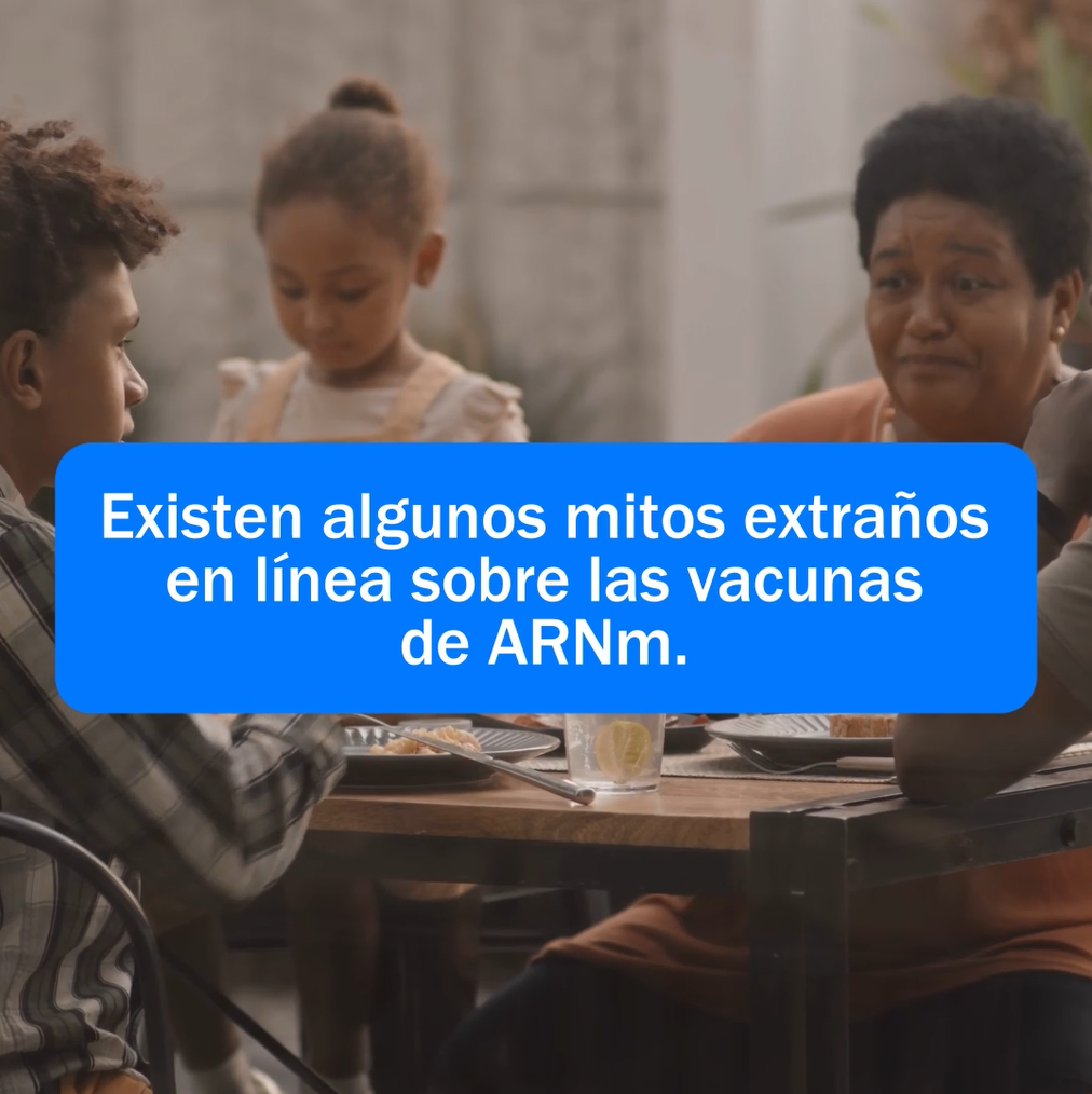 Image of a young black boy, a young black girl, and an older black woman sitting at a table eating a meal together.