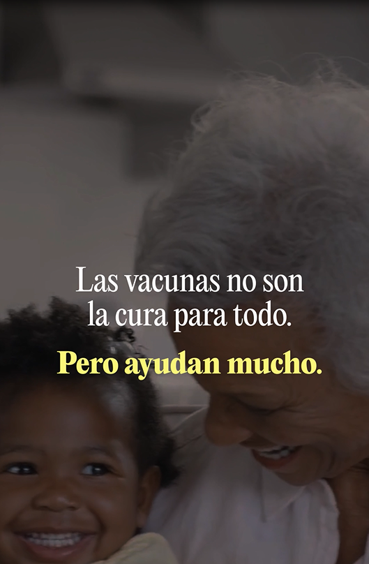 Image of a Black family gathering including a grandmother and granddaughter smiling