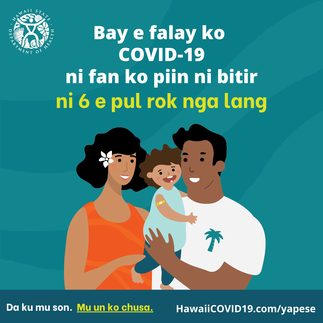 A man and woman smile holding a smiling baby