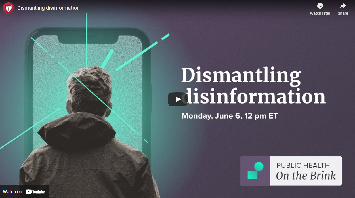 Image shows the back of a young person's head and they look into a large phone screen