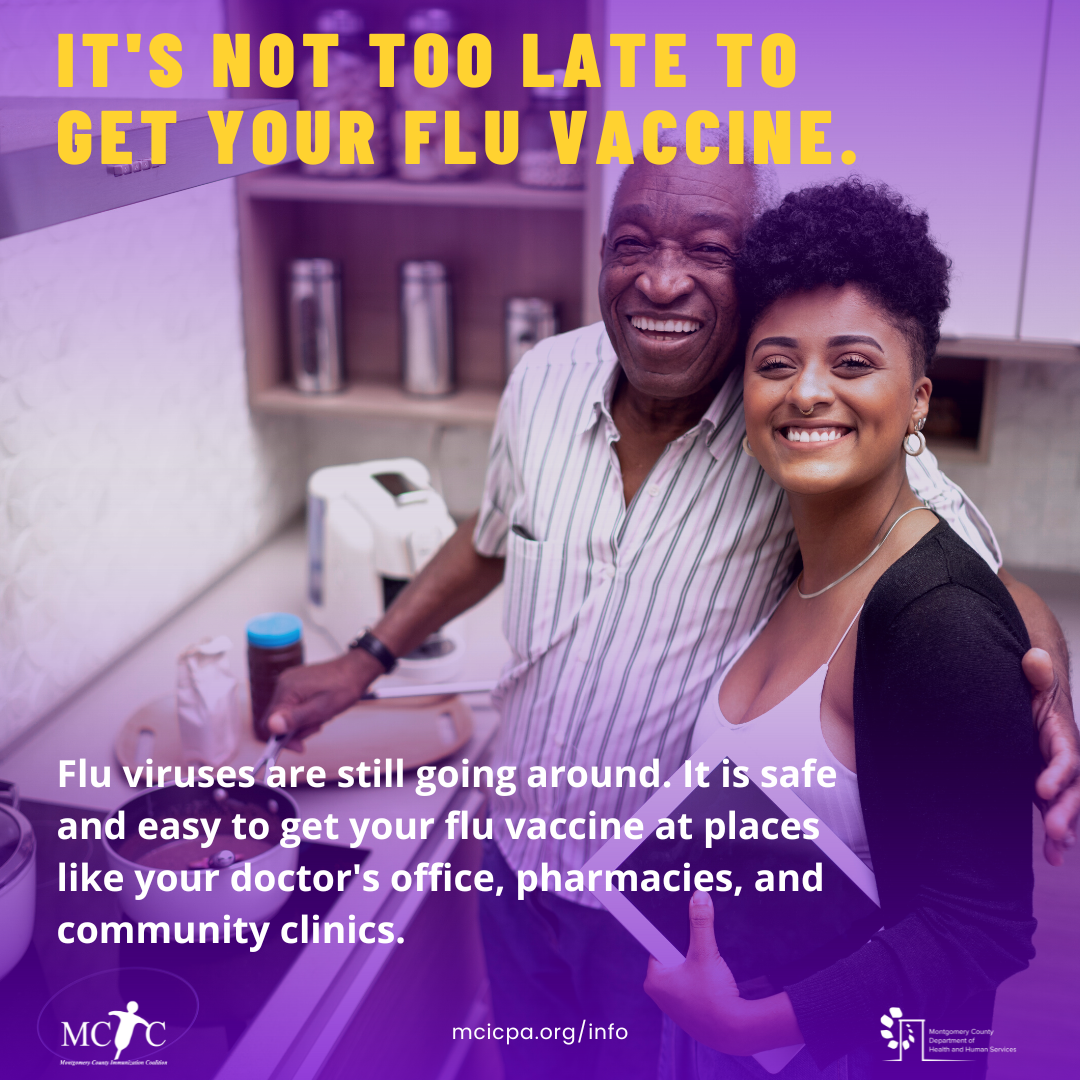 A young Black woman and an older Black man embrace and smile