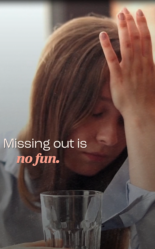 A white girl facepalms her forehead.