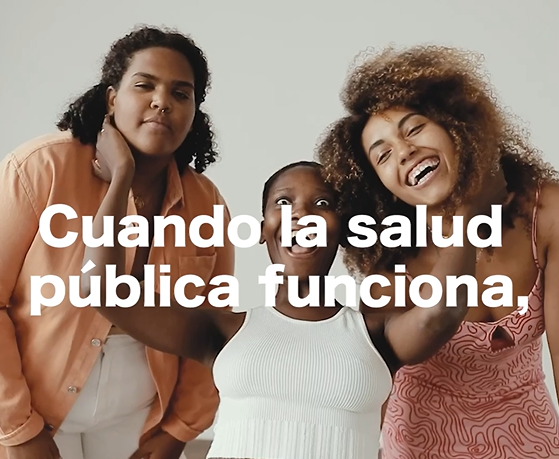 Graphic includes three Black women who are laughing together. Text says "When public health works"