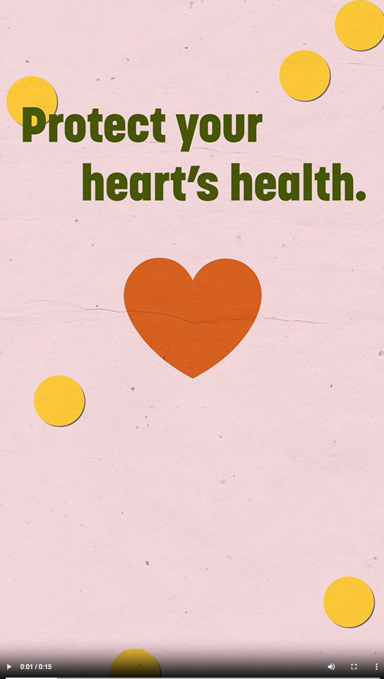 Video still with red heart and text and pink background with polka dots.