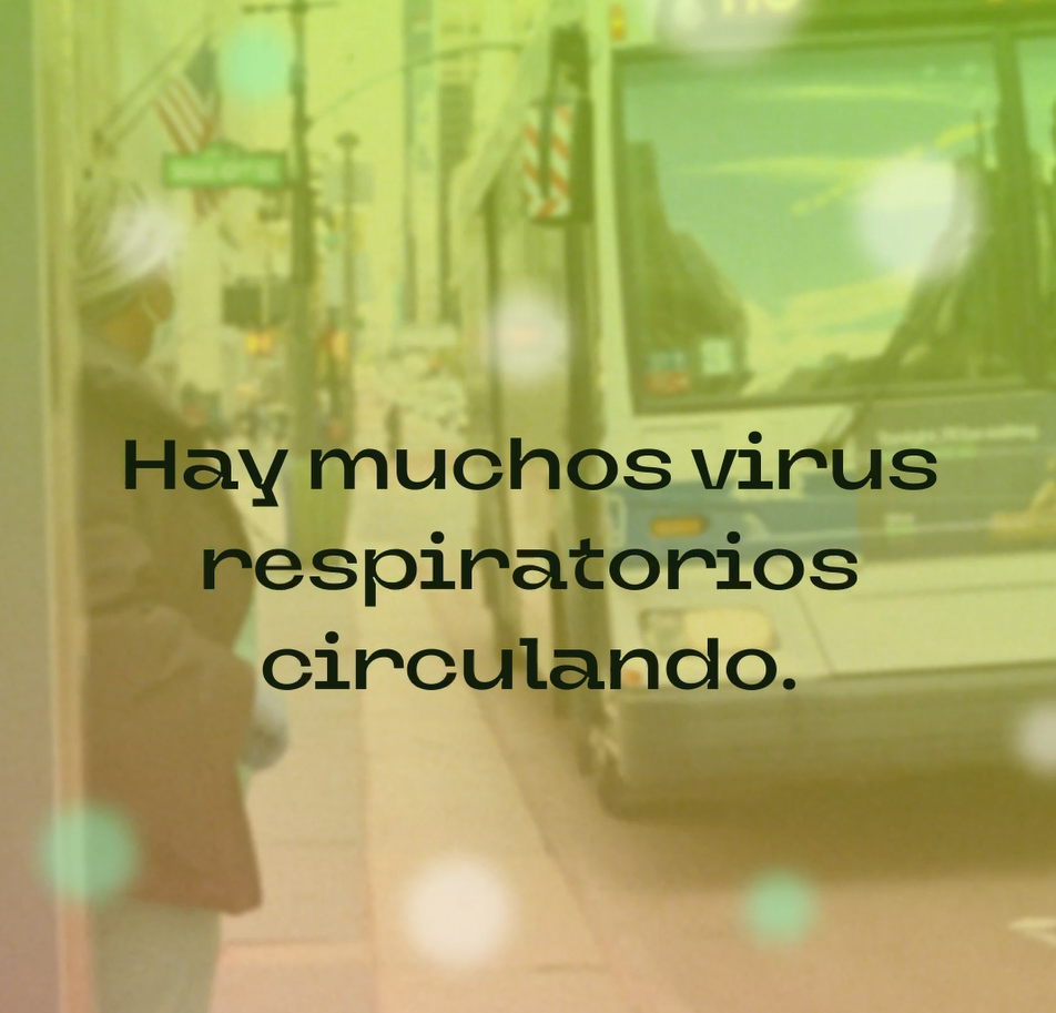 A Black woman wearing a mask boards a bus